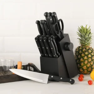 19-piece-knife_1 19 piece knife set in its black block on a kitchen counter beside fresh fruit