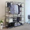 portable-closet-organizer-wardrobe_4 Steel frame with the fabric cover removed, loaded with shirts, bins and shoes