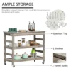 rolling-kitchen-cart-stainless-top_5 Kitchen island cart holding plates, jars and pans on two open shelves