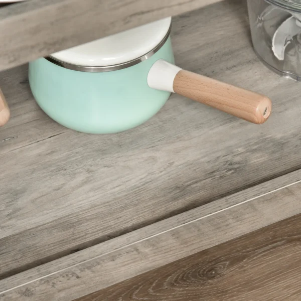 rolling-kitchen-cart-stainless-top_8 Grey woodgrain lower shelf with a raised lip holding a small saucepan